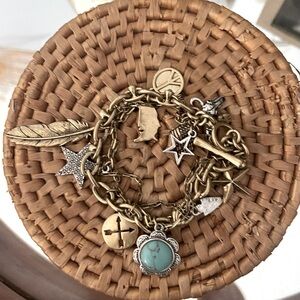 Lucky Brand American Gold Tone Charm Bracelet peace sign, feathers, stars beads